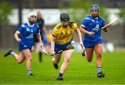 7 May 2023; Saoirse Gacquin of Roscommon in action against Aoife Gee, left, and Katelyn Shore of Laois during the Electric Ireland Minor B All-Ireland Championship Final match between Laois and Roscommon at St. Brendan’s Park in Birr, Offaly. Photo by Tom Beary/Sportsfile