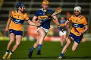 8 May 2023; Sean Kenneally of Tipperary in action against Jack O'Neill, left, and Daithi Lohan of Clare during the oneills.com Munster GAA Hurling U20 Championship Semi Final match between Tipperary and Clare at FBD Semple Stadium in Thurles, Tipperary. Photo by Tom Beary/Sportsfile