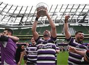 7 May 2023; Jordan Coghlan of Terenure celebrates with the trophy after his side's victory in the Energia All-Ireland League Men's Division 1A Final match between Clontarf and Terenure at the Aviva Stadium in Dublin. Photo by Harry Murphy/Sportsfile