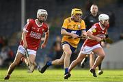 9 May 2023; Eoghan Gunning of Clare in action against Carthaigh Cronin of Cork during the 2023 Electric Ireland Munster GAA Hurling Minor Championship Final  match between Cork and Clare at FBD Semple Stadium in Thurles, Tipperary. Photo by Harry Murphy/Sportsfile