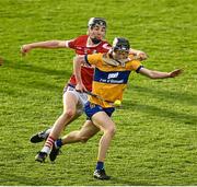 9 May 2023; Michael Collins of Clare in action against Cillian O'Callaghan of Cork during the 2023 Electric Ireland Munster GAA Hurling Minor Championship Final  match between Cork and Clare at FBD Semple Stadium in Thurles, Tipperary. Photo by Harry Murphy/Sportsfile