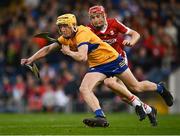 9 May 2023; Eoghan Gunning of Clare in action against Conor McCarthy of Cork during the 2023 Electric Ireland Munster GAA Hurling Minor Championship Final  match between Cork and Clare at FBD Semple Stadium in Thurles, Tipperary. Photo by Harry Murphy/Sportsfile