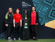10 May 2023; Emma Saunders, Brooke Rowe and Daira Cotenu, from CBS Westland Row, with the FIFA Women’s World Cup trophy during a grassroots girls schools blitz, part of the FIFA Women’s World Cup Trophy Tour in Dublin, at Irishtown Stadium in Dublin. The FIFA Women’s World Cup Trophy Tour began in February and is visiting all 32 of the tournament’s participating nations – more countries than ever before! The tour is ‘Going Beyond’ to inspire people of all ages to get excited about the FIFA Women’s World Cup Australia & New Zealand 2023. Photo by Stephen McCarthy/Sportsfile