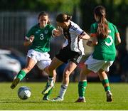 11 May 2023; Lilly Nele Damm of Germany in action against Lauryn McCabe of Republic of Ireland, left, and Clodagh Daly during the Women's U16 International Friendly match between Republic of Ireland and Germany at St Kevins FC in Dublin. Photo by Tyler Miller/Sportsfile