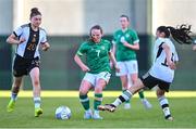 11 May 2023; Freya Healy of Republic of Ireland in action against Tessa Zimmerman of Germany, left, and Sari Saeland during the Women's U16 International Friendly match between Republic of Ireland and Germany at St Kevins FC in Dublin. Photo by Tyler Miller/Sportsfile