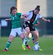 11 May 2023; Tessa Zimmerman of Germany in action against Katie Lawlee of Republic of Ireland during the Women's U16 International Friendly match between Republic of Ireland and Germany at St Kevins FC in Dublin. Photo by Tyler Miller/Sportsfile