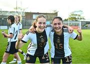 11 May 2023; Ida Katharina Daedelow of Germany, left, and Sari Saeland of Germany celebrate after their side's victory in the Women's U16 International Friendly match between Republic of Ireland and Germany at St Kevins FC in Dublin. Photo by Tyler Miller/Sportsfile