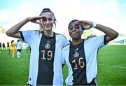 11 May 2023; Svenja Vöhringer of Germany, left, and Franziska Mbuyi after their side's victory in the Women's U16 International Friendly match between Republic of Ireland and Germany at St Kevins FC in Dublin. Photo by Tyler Miller/Sportsfile
