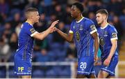12 May 2023; Roland Idowu of Waterford, right, is congratulated by teammate Niall O'Keeffe after scoring his side's fourth goal during the SSE Airtricity Men's First Division match between Waterford and Cobh Ramblers at the RSC in Waterford. Photo by Michael P Ryan/Sportsfile
