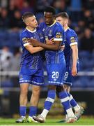 12 May 2023; Roland Idowu of Waterford, right, is congratulated by teammate Niall O'Keeffe after scoring his side's fourth goal during the SSE Airtricity Men's First Division match between Waterford and Cobh Ramblers at the RSC in Waterford. Photo by Michael P Ryan/Sportsfile