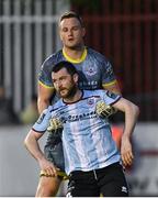 12 May 2023; Drogheda United goalkeeper Colin McCabe consoles teammate Ryan Brennan after Chris Forrester, not pictured, scored the third goal for St Patrick's Athletic during the SSE Airtricity Men's Premier Division match between St Patrick's Athletic and Drogheda United at Richmond Park in Dublin. Photo by Piaras Ó Mídheach/Sportsfile