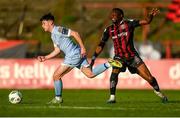 12 May 2023; Adam O'Reilly of Derry City in action against Jonathan Afolabi of Bohemians during the SSE Airtricity Men's Premier Division match between Bohemians and Derry City at Dalymount Park in Dublin. Photo by Stephen McCarthy/Sportsfile