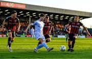 12 May 2023; Ollie O'Neill of Derry City in action against Bohemians players, from left, Krystian Nowak, Adam McDonnell and Keith Buckley during the SSE Airtricity Men's Premier Division match between Bohemians and Derry City at Dalymount Park in Dublin. Photo by Tyler Miller/Sportsfile