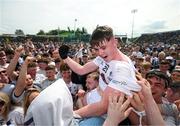 13 May 2023; Eoin Cully of Kildare celebrates with supporters after after the Eirgrid GAA Football All-Ireland U20 Championship Final between Kildare and Sligo at Kingspan Breffni in Cavan. Photo by Stephen McCarthy/Sportsfile