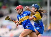13 May 2023; Karen Kennedy of Tipperary is tackled by Aine O'Loughlin of Clare during the Munster Senior Camogie Championship Final between Clare and Tipperary at FBD Semple Stadium in Thurles, Tipperary. Photo by Ray McManus/Sportsfile