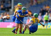 13 May 2023; Róisín Howard of Tipperary is tackled by Abby Walsh and Aoife Keane of Clare, 12, during the Munster Senior Camogie Championship Final between Clare and Tipperary at FBD Semple Stadium in Thurles, Tipperary. Photo by Ray McManus/Sportsfile
