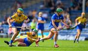 13 May 2023; Róisín Howard of Tipperary is tackled by Abby Walsh, left, and Aoife Keane of Clare, during the Munster Senior Camogie Championship Final between Clare and Tipperary at FBD Semple Stadium in Thurles, Tipperary. Photo by Ray McManus/Sportsfile