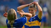 13 May 2023; The Tipperary joint captains Clodagh Quirke, left, and Karen Kennedy adjust their hair before collecting the cup after the Munster Senior Camogie Championship Final between Clare and Tipperary at FBD Semple Stadium in Thurles, Tipperary. Photo by Ray McManus/Sportsfile