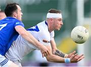 13 May 2023; Trevor Collins of Laois in action against Conor Rehill of Cavan during the Tailteann Cup Group 1 Round 1 match between Cavan and Laois at Kingspan Breffni in Cavan. Photo by Stephen McCarthy/Sportsfile