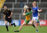 13 May 2023; Finbar Roarty of Donegal in action against Dylan Edwards of Cavan during the Ulster GAA Minor Football Championship Quarter-Final match between Cavan and Donegal at Kingspan Breffni in Cavan. Photo by Stephen McCarthy/Sportsfile