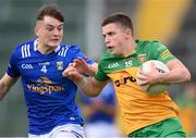 13 May 2023; Eoin Gallagher of Donegal in action against Fiachra Brady of Cavan during the Ulster GAA Minor Football Championship Quarter-Final match between Cavan and Donegal at Kingspan Breffni in Cavan. Photo by Stephen McCarthy/Sportsfile