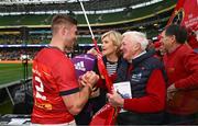 13 May 2023; Jack Crowley of Munster with his grandfather Billy after his side's victory in the United Rugby Championship Semi-Final match between Leinster and Munster at the Aviva Stadium in Dublin. Photo by Harry Murphy/Sportsfile