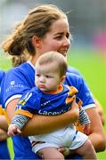 13 May 2023; Ereena Fryday of Tipperary and her six month old nephew Tomás Lacey watch the cup presentation after the Munster Senior Camogie Championship Final between Clare and Tipperary at FBD Semple Stadium in Thurles, Tipperary. Photo by Ray McManus/Sportsfile