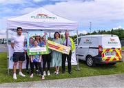 14 May 2023; Sinéad O'Reilly, Ciara Fitpatrick, Dorothy Aylward and Naoise Fitzpatrick from Cavan with Olympian swimmer Nicolas Quinn, left, and Maria King and Mark Gavin from Bus Éireann during the Community Games Swimming Finals 2023 at Lough Lanagh Swimming Complex in Castlebar, Mayo, which had over 800 children participating. Photo by Piaras Ó Mídheach/Sportsfile