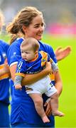 13 May 2023; Ereena Fryday of Tipperary and her six month old nephew Tomás Lacey watch the cup presentation after the Munster Senior Camogie Championship Final between Clare and Tipperary at FBD Semple Stadium in Thurles, Tipperary. Photo by Ray McManus/Sportsfile
