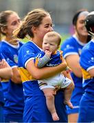 13 May 2023; Ereena Fryday of Tipperary with her six month old nephew Tomás Lacey watch the cup presentation after the Munster Senior Camogie Championship Final between Clare and Tipperary at FBD Semple Stadium in Thurles, Tipperary. Photo by Ray McManus/Sportsfile