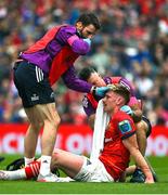 13 May 2023; Ben Healy of Munster receives medical attention during the United Rugby Championship Semi-Final match between Leinster and Munster at the Aviva Stadium in Dublin. Photo by Brendan Moran/Sportsfile