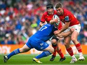 13 May 2023; Jack Crowley of Munster is tackled by Cian Healy of Leinster during the United Rugby Championship Semi-Final match between Leinster and Munster at the Aviva Stadium in Dublin. Photo by Brendan Moran/Sportsfile