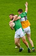 14 May 2023; Cahir Healy of London is tackled by Dylan Hyland of Offaly during the Tailteann Cup Group 1 Round 1 match between Offaly and London at Glenisk O'Connor Park in Tullamore, Offaly. Photo by Eóin Noonan/Sportsfile
