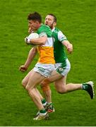 14 May 2023; Dylan Hyland of Offaly is tackled by Cahir Healy of London during the Tailteann Cup Group 1 Round 1 match between Offaly and London at Glenisk O'Connor Park in Tullamore, Offaly. Photo by Eóin Noonan/Sportsfile