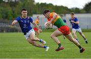 14 May 2023; Conor Crowley of Carlow in action against Malachy Stone of Wicklow during the Tailteann Cup Group 3 Round 1 match between Wicklow and Carlow at Echelon Park in Aughrim, Wicklow. Photo by Tyler Miller/Sportsfile