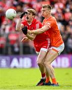 14 May 2023; Brendan Rogers of Derry in action against Rian O'Neill of Armagh during the Ulster GAA Football Senior Championship Final match between Armagh and Derry at St Tiernach’s Park in Clones, Monaghan. Photo by Ramsey Cardy/Sportsfile
