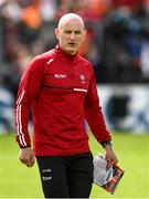 14 May 2023; Derry interim manager Ciaran Meenagh holds the match programme showing former Derry manager Rory Gallagher during the Ulster GAA Football Senior Championship Final match between Armagh and Derry at St Tiernach’s Park in Clones, Monaghan. Photo by Harry Murphy/Sportsfile