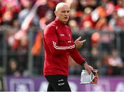 14 May 2023; Derry interim manager Ciaran Meenagh holds the match programme showing former Derry manager Rory Gallagher during the Ulster GAA Football Senior Championship Final match between Armagh and Derry at St Tiernach’s Park in Clones, Monaghan. Photo by Harry Murphy/Sportsfile