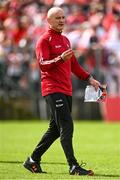 14 May 2023; Derry interim manager Ciaran Meenagh holds the match programme showing former Derry manager Rory Gallagher during the Ulster GAA Football Senior Championship Final match between Armagh and Derry at St Tiernach’s Park in Clones, Monaghan. Photo by Harry Murphy/Sportsfile