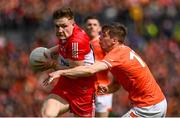 14 May 2023; Ethan Doherty of Derry is tackled by Andrew Murnin of Armagh during the Ulster GAA Football Senior Championship Final match between Armagh and Derry at St Tiernach’s Park in Clones, Monaghan. Photo by Harry Murphy/Sportsfile