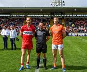 14 May 2023; Derry captain Conor Glass and Armagh captain Rian O'Neill with referee David Gough before the Ulster GAA Football Senior Championship Final match between Armagh and Derry at St Tiernach’s Park in Clones, Monaghan. Photo by Harry Murphy/Sportsfile