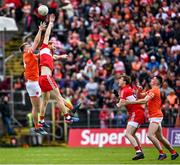 14 May 2023; Conor Glass of Derry and Rian O'Neill of Armagh compete for the second half throw-in during the Ulster GAA Football Senior Championship Final match between Armagh and Derry at St Tiernach’s Park in Clones, Monaghan. Photo by Ramsey Cardy/Sportsfile