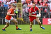 14 May 2023; Conor Glass of Derry in action against Rian O'Neill of Armagh during the Ulster GAA Football Senior Championship Final match between Armagh and Derry at St Tiernach’s Park in Clones, Monaghan. Photo by Ramsey Cardy/Sportsfile