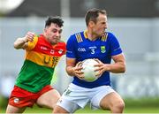 14 May 2023; Paul McLoughlin of Wicklow in action against Jamie Clarke of Carlow during the Tailteann Cup Group 3 Round 1 match between Wicklow and Carlow at Echelon Park in Aughrim, Wicklow. Photo by Tyler Miller/Sportsfile