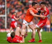 14 May 2023; Aidan Forker of Armagh and Gareth McKinless of Derry tussle during the Ulster GAA Football Senior Championship Final match between Armagh and Derry at St Tiernach’s Park in Clones, Monaghan. Photo by Harry Murphy/Sportsfile