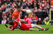 14 May 2023; Jarly Óg Burns of Armagh is fouled by Brendan Rogers of Derry during the Ulster GAA Football Senior Championship Final match between Armagh and Derry at St Tiernach’s Park in Clones, Monaghan. Photo by Harry Murphy/Sportsfile