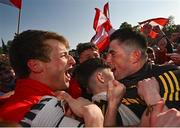 14 May 2023; Derry players Brendan Rogers, left, and goalkeeper Odhran Lynch celebrate after their victory in the Ulster GAA Football Senior Championship Final match between Armagh and Derry at St Tiernach’s Park in Clones, Monaghan. Photo by Ramsey Cardy/Sportsfile