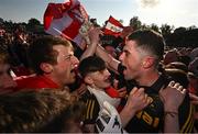 14 May 2023; Derry players Brendan Rogers, left, and goalkeeper Odhran Lynch celebrate after their victory in the Ulster GAA Football Senior Championship Final match between Armagh and Derry at St Tiernach’s Park in Clones, Monaghan. Photo by Ramsey Cardy/Sportsfile