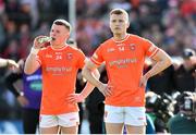 14 May 2023; Armagh joint-captains Aidan Nugent, left, and Rian O'Neill watch on during the penalty shoot-out in the Ulster GAA Football Senior Championship Final match between Armagh and Derry at St Tiernach’s Park in Clones, Monaghan. Photo by Ramsey Cardy/Sportsfile