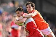 14 May 2023; Shane McGuigan of Derry in action against James Morgan of Armagh during the Ulster GAA Football Senior Championship Final match between Armagh and Derry at St Tiernach’s Park in Clones, Monaghan. Photo by Ramsey Cardy/Sportsfile
